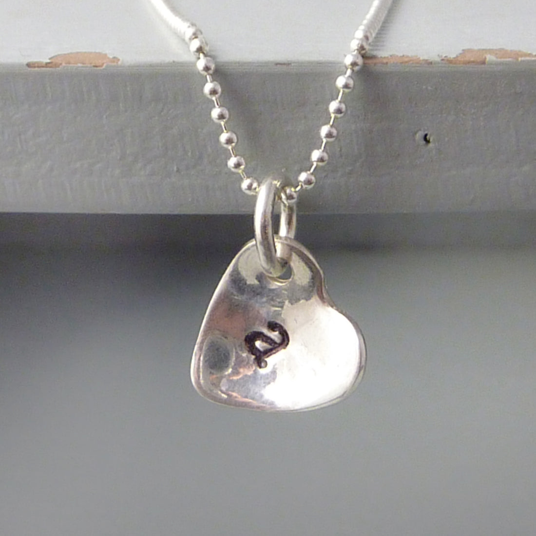 Sterling silver cupped heart initial necklace