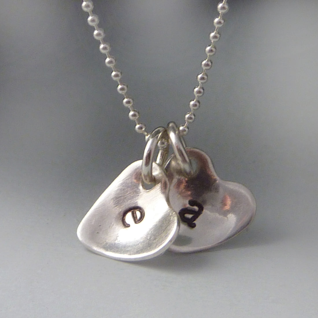 Sterling silver cupped heart initial necklace