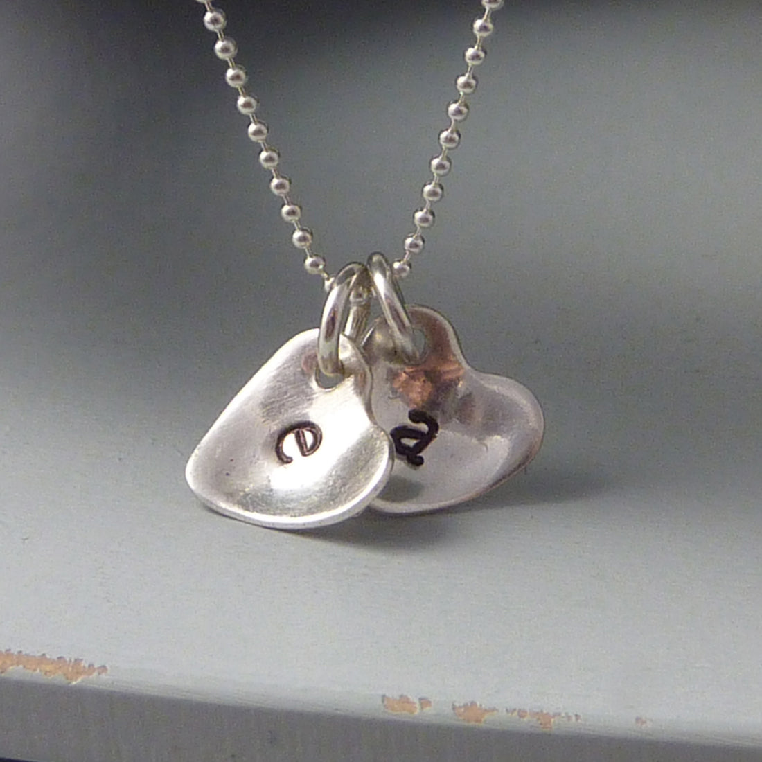Sterling silver cupped heart initial necklace