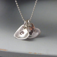 Sterling silver cupped heart initial necklace
