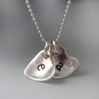 Sterling silver cupped heart initial necklace